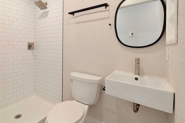 Bathroom with tiled walk-in shower